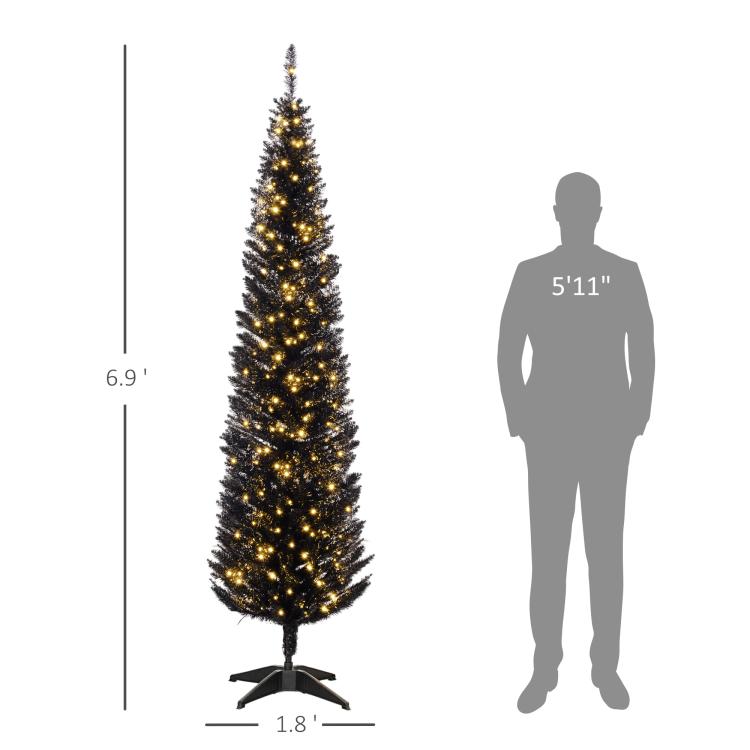 Slim pre-lit pencil Christmas tree with warm white LED lights, sized against silhouette