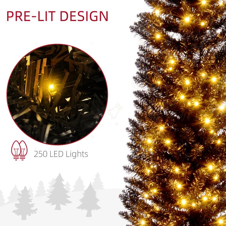 Close-up of glowing warm white LEDs on dark pencil tree branches