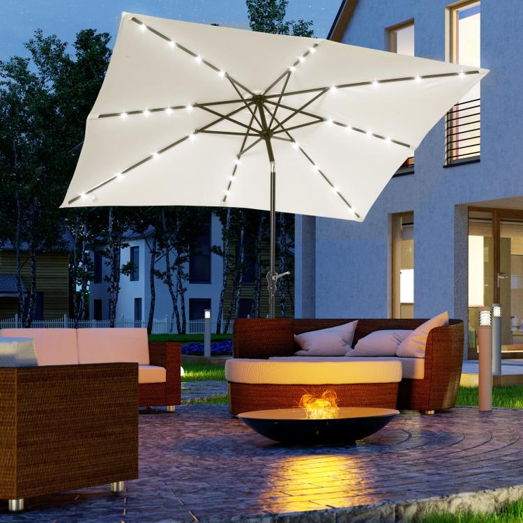 Cream white solar LED patio umbrella with glowing lights, open canopy and center pole.