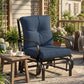 Dark blue cushioned patio glider chair with arched armrests and curved base
