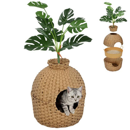 Rattan-style cat litter box enclosure with faux plant on top and round entry opening
