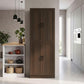 Brown freestanding pantry cabinet with four doors and metal handles in home setting