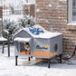 Heated cat house with blue roof, front window, and warm orange heating pad glow