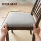 Gray upholstered dining chair seat with hands measuring the seat width