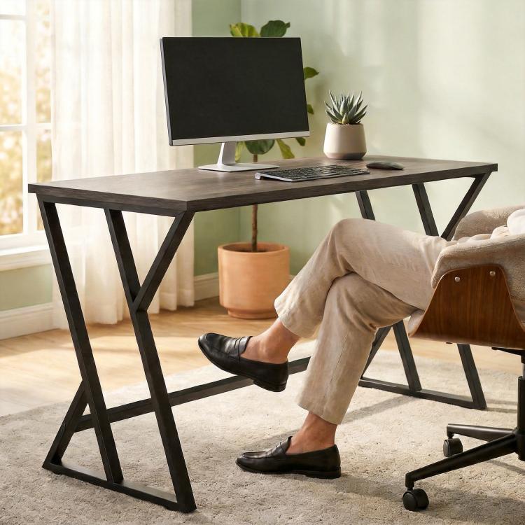 Black metal Z-leg desk with dark gray top, suitable for computer setup