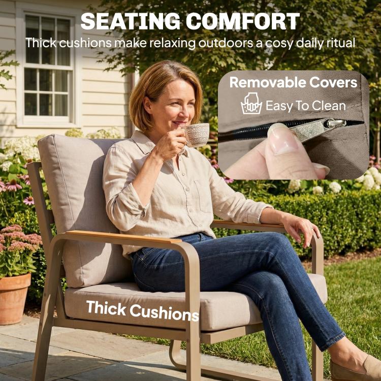Outdoor armchair with thick cushions, removable cover seam details, and metal arm frame