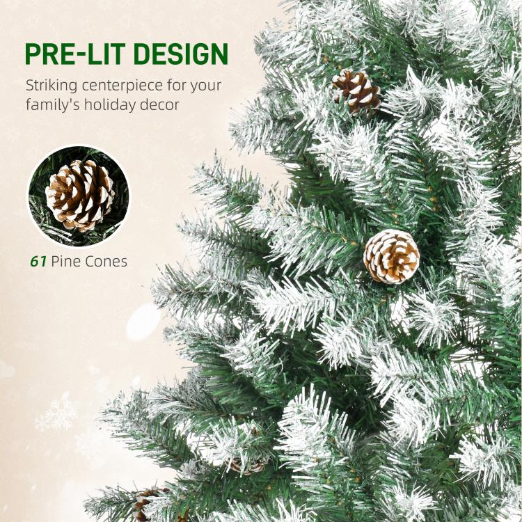 Snow-dusted fir branch detail with pine cones and white frosted needles