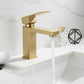 Brushed gold single-handle lavatory faucet mounted on countertop with spout.
