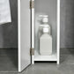 White cabinet door open to reveal inner open shelf storage for toiletries.