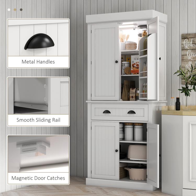 White pantry cabinet with metal handles, sliding rail drawer, and magnetic door catches