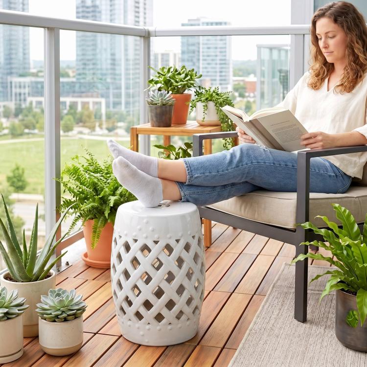 White ceramic garden stool with woven lattice sides and rounded top