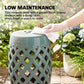 Teal glazed ceramic garden stool with lattice cutouts being wiped clean