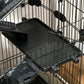 Black multi-level small animal cage with slide-out tray and wheel base