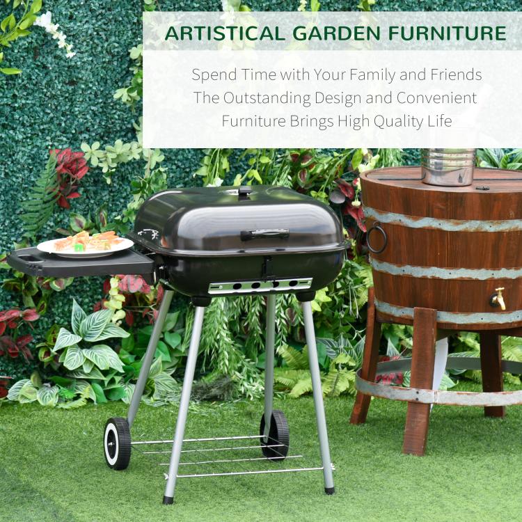 Charcoal barbecue grill with domed lid and side shelf on wheeled stand