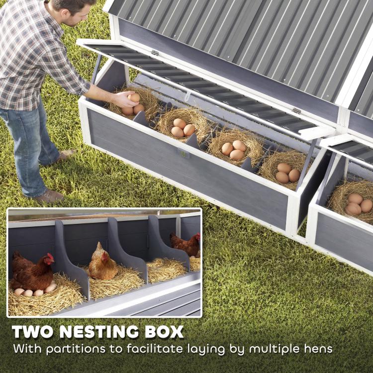Outdoor chicken coop with two nesting boxes, straw bedding, and accessible lid opening