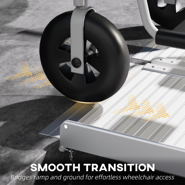 Wheelchair rear wheel on aluminum ramp with textured non-slip traction surface