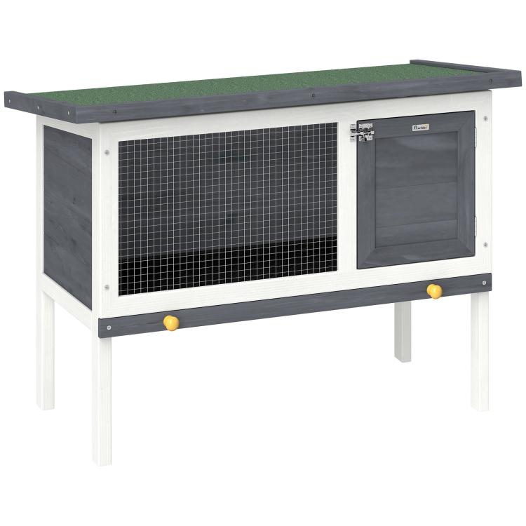 Outdoor elevated rabbit hutch with mesh side panel and dark hinged door, asphalt roof