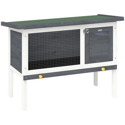 Outdoor elevated rabbit hutch with mesh side panel and dark hinged door, asphalt roof