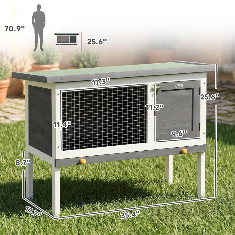 Outdoor elevated rabbit hutch with wire-mesh front panel and dark side door