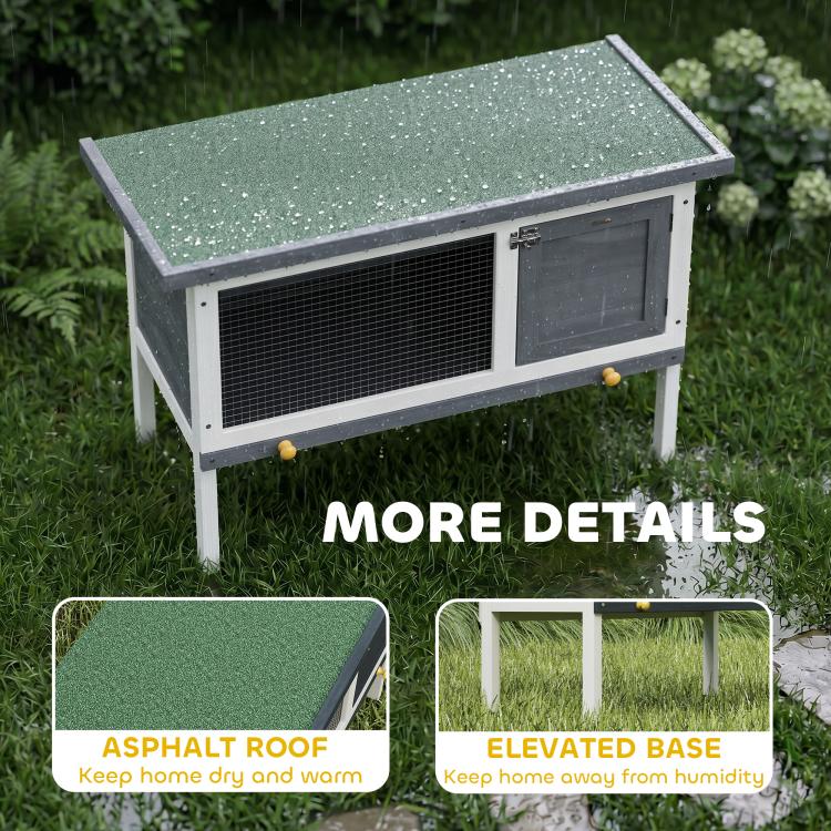 Outdoor elevated rabbit hutch with textured asphalt roof and raised legs