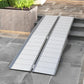 Doorway aluminum wheelchair ramp with ribbed grip panels and raised edges
