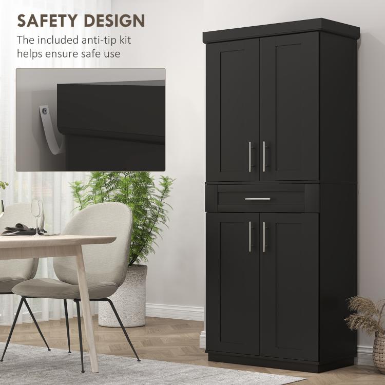 Black freestanding pantry cabinet with upper and lower doors and a front pull-out drawer