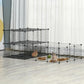 Black pet playpen cage with wire mesh panels and interior platforms in a room