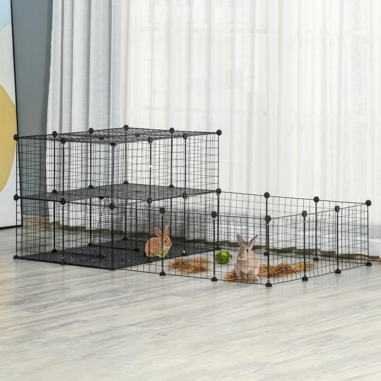 Black pet playpen cage with wire mesh panels and interior platforms in a room