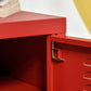 Red locker-style door with metal handle and open cabinet interior