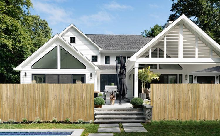 Natural bamboo privacy fence panel with vertical slat screening for outdoor use