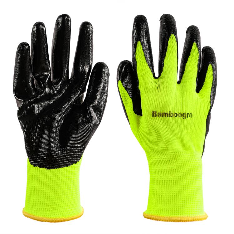 Pair of neon yellow knit work gloves with black non-slip palm grips