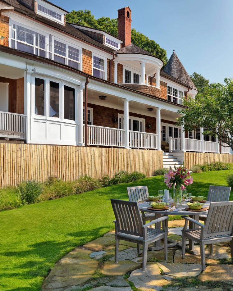 Natural bamboo privacy fence panel along a garden yard