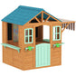 Wooden outdoor playhouse with blue shingle roof, side windows, and striped awning detail