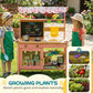 Kids using outdoor wooden mud kitchen with canopy, chalkboard menu, sink and planters