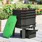 Worm composter with open lid, stacked trays, and front collection base in dark green