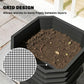 Worm composter tray filled with dark compost soil and a visible worm near mesh insert