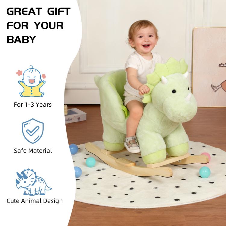 Green plush dinosaur rocking horse ride-on with wooden base, padded seat and safety belt
