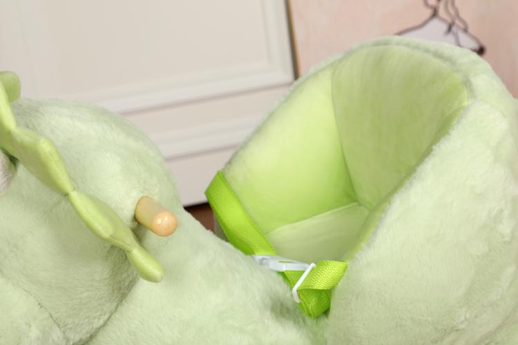 Green plush dinosaur rocking horse seat with safety belt and green strap