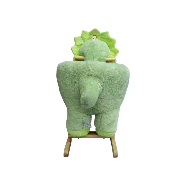 Green plush dinosaur rocking horse with wooden base and small horn