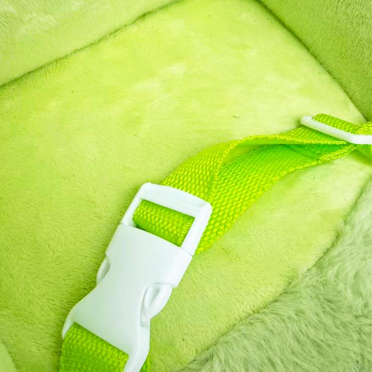 Green fabric safety belt across plush dinosaur rocker seat