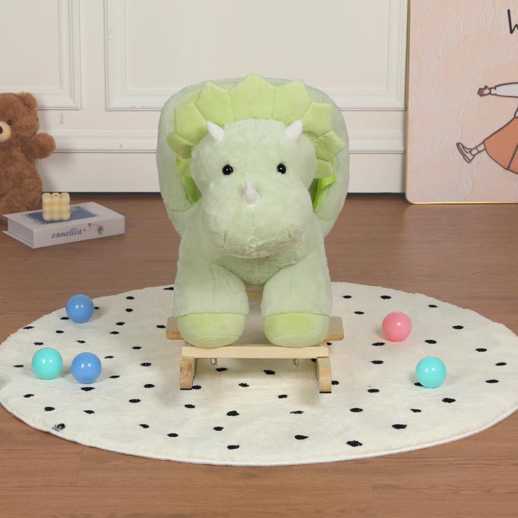 Green plush dinosaur rocking horse ride-on with wooden base and safety belt, front view