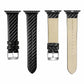 Carbon fiber watch strap with tan leather backing and metal buckle