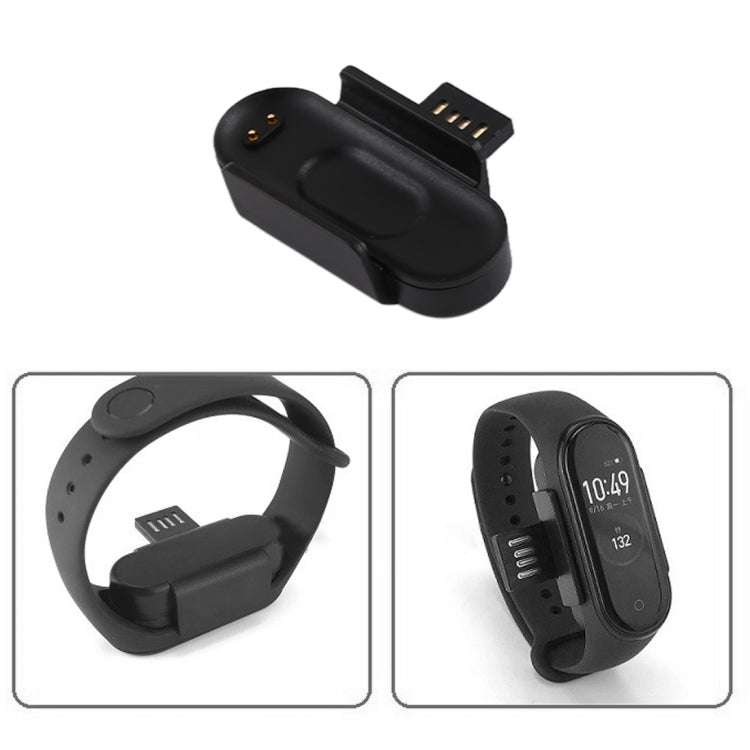 Black charging dock cradle with contact pins and wearable connection