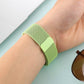 Mint green woven nylon magnetic watch band on wrist with rectangular clasp
