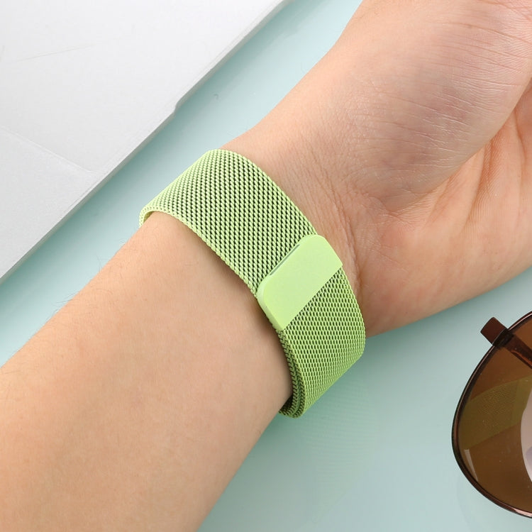 Mint green woven nylon magnetic watch band on wrist with rectangular clasp