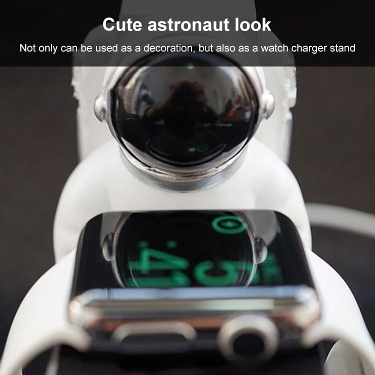 Close-up astronaut stand with Apple Watch resting on square charging dock