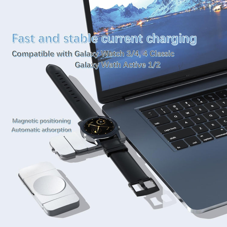 Black magnetic watch charging dongle with round contact plate and strap