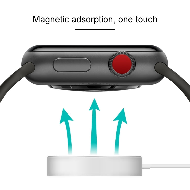 Magnetic charging puck connected to a smartwatch on a charging dock.
