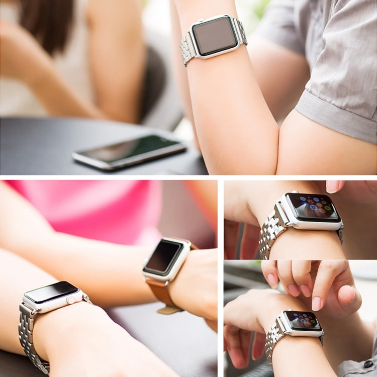 Stainless steel watch band worn on wrist with metal link bracelet