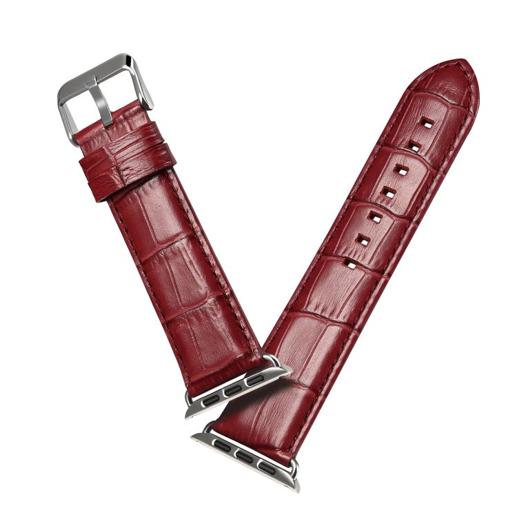 Dark red crocodile-grain leather watch band with metal buckle and clasp holes
